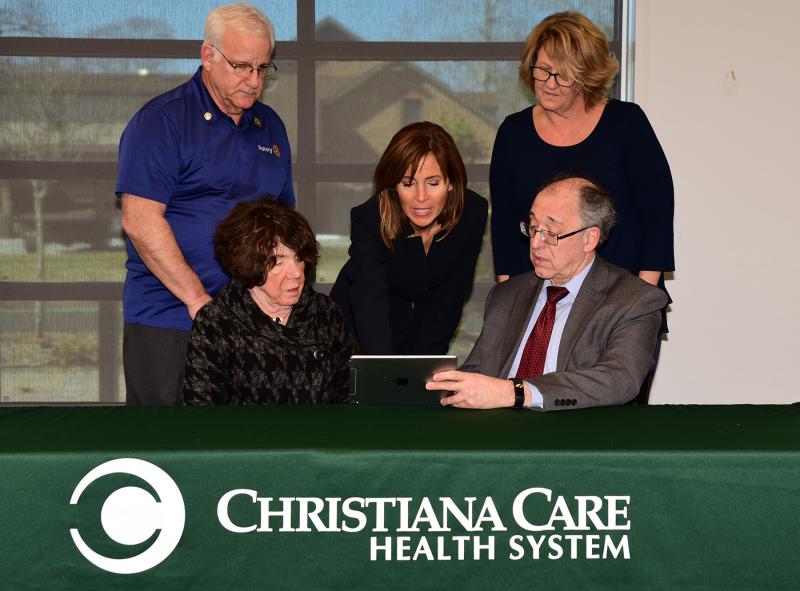 Jennifer Rittereiser, MPH, Swank Memory Care Center, Christiana Care demonstrates innovative approaches to improving memory care. Shown are (l-r) David Keller, director, Lewes-Rehoboth Rotary Club; Judy Kirkland, Swank Leadership Council, Christiana Care; Rittereiser; Carlene Roach, Georgetown-Millsboro Rotary Club; and James Ellison, MD, endowed chair, Swank Memory Care Center, Christiana Care.